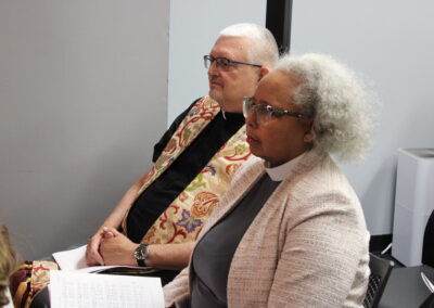 Clergy seated and listening during the service
