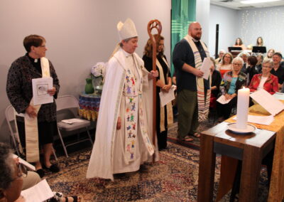 Bishop in mitre processing with clergy