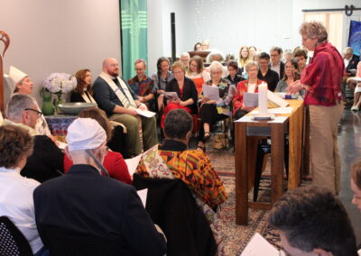 Clergy member speaking at the lectern during the service